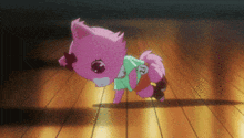 a pink animal with the number 12 on it 's chest