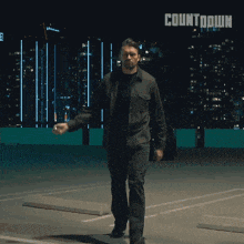 a man is walking in a parking lot with the word countdown on the bottom