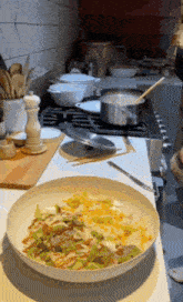 a bowl of food is sitting on a kitchen counter