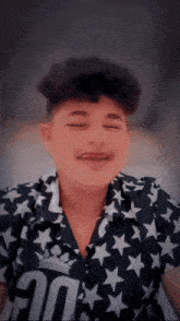 a young man wearing a shirt with stars and the number 10 on it