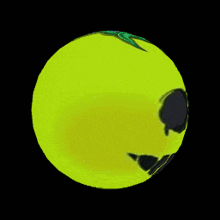 a yellow circle with a face on it on a black background
