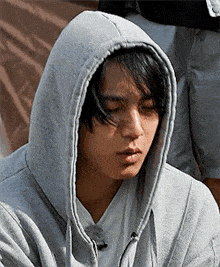 a close up of a person wearing a hooded jacket