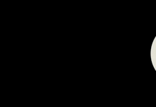 a close up of a gun barrel with a silhouette of a man in the background