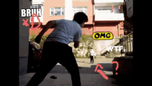 a man in a white shirt is standing in front of a building with a sign that says omg