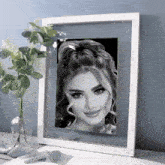 a black and white photo of a woman in a frame