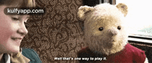 a teddy bear is sitting next to a child and says " well that 's one way to play it "