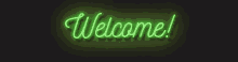 a neon sign that says welcome on a dark background
