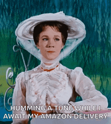 a woman in a white dress and hat is humming a tune while waiting for her amazon delivery