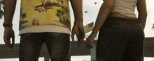 a man in a hawaiian shirt is holding hands with a woman