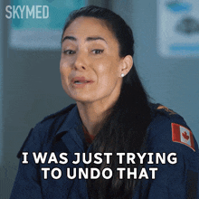 a woman with a canadian flag on her uniform is crying and says i was just trying to undo that