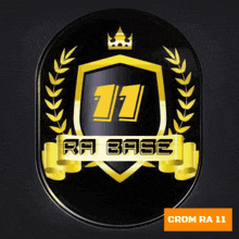 a black and gold logo for ra base with the number 11 on it