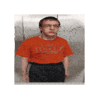 a young man wearing a red shirt with the word uslt on it