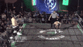 a wrestling ring with the words wtv live on the bottom right