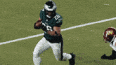 a football player with the number 26 on his jersey is running on the field