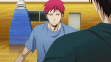 a man with red hair is standing next to another man in a blue shirt