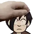 a hand is putting a donut on a boy 's head .