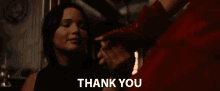 a woman is holding a man 's hand and the words thank you are above her