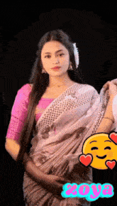 a woman wearing a pink blouse and a white saree has the name zoya on the bottom right