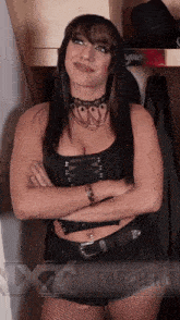 a woman standing with her arms crossed in a closet with xxx archer written on the bottom