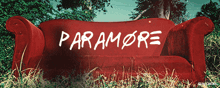 a red couch with paramore written on it in white letters