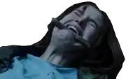 a woman with a stick in her mouth is laying down