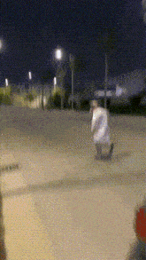 a blurry picture of a person walking down a street