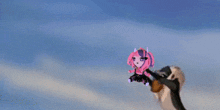 a cartoon character is flying through the air with a person holding it