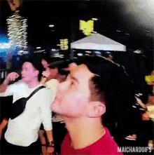 a man in a red shirt with maichardgifs on the bottom