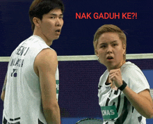 two badminton players are standing next to each other with the words nak gaduh ke written on the bottom