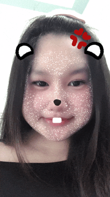 a girl with a drawing of a squirrel on her face