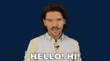 a man in a striped shirt says hello hi with his eyes closed