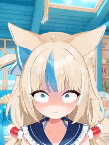 a close up of a blonde anime girl with cat ears and a sailor outfit making a funny face .