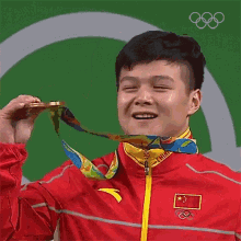 Olympic Gold Bite Olympics GIF