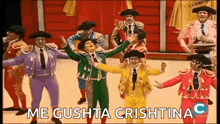 a group of men dressed as bullfighters are dancing on stage .