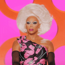 a drag queen says " the f * ck " while wearing a pink and black dress