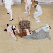 a group of people are laying on the floor in a circle with chinese writing on the bottom