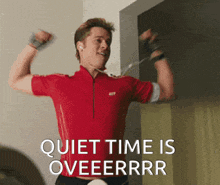 a man in a red shirt is flexing his muscles with the words quiet time is oveeerrr behind him