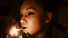 a woman with a tattoo on her neck is lighting a cigarette with a lighter