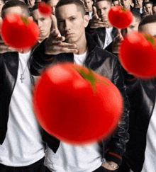 a group of men are holding tomatoes in front of their faces ..