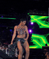 a woman in a crop top is dancing on stage