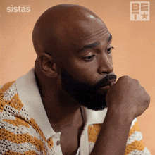 a man with a beard and a striped shirt is featured on the cover of sistas