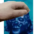 a pixelated image of a hand touching a blue skull