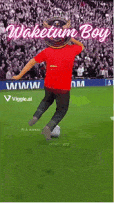 a man in a red shirt kicks a soccer ball on a field