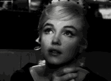 a close up of a woman 's face with vintageho written on the bottom