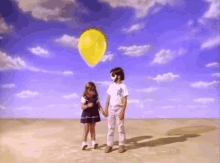 holding hands brothers and sisters siblings yellow balloon friends