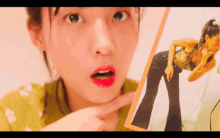 a woman is looking at herself in the mirror