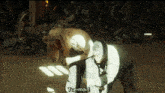 a man is holding another man in a room with the words tue-moi written on the bottom