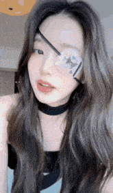 a woman with a patch on her eye that says ' i love you '