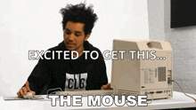 a man sitting in front of an old computer with the words excited to get this the mouse above him