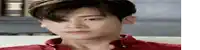 a young man wearing a red shirt is looking down .